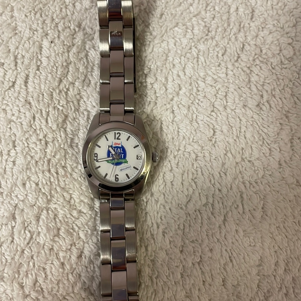 NEW “Libby’s real fruit” branded watch. With date. Stainless steel band.